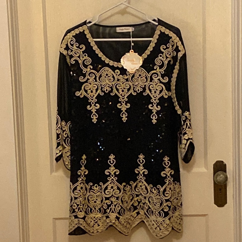 Simply Couture.  Black with ivory and gold embroidery.  Black sequins too!